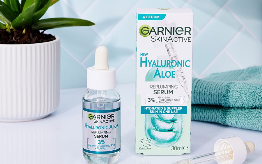 Garnier Hyaluronic Aloe Serum container and box on a bathroom shelf
