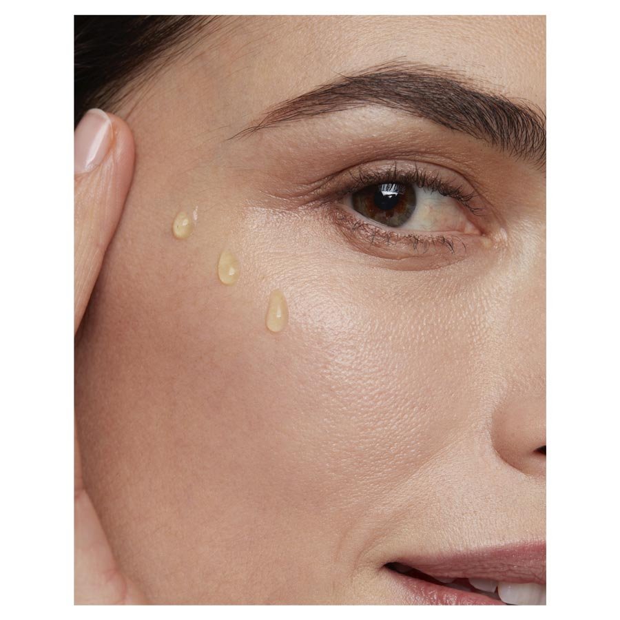 Garnier Organics Lavandin Smooth & Glow Facial Oil texture on womans face